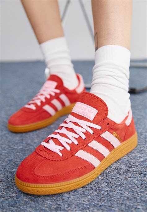 adidas originals handball spezial trainers in red and pink.